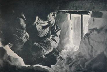 Clearing Drift from Window of Hut at Cape Adare