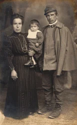 Postcard with an Infantry Soldier, Gunner, in the Uniform of War with His Family