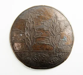 Convex plaque with trees, clouds and flowers