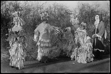 People in costume performing in a Mummers
