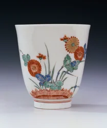 A Bottger Kakiemon flared beaker painted with chrysanthemum and grasses, c.1725