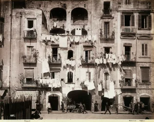 Façade of a building with laundry hanging out to dry, Naples