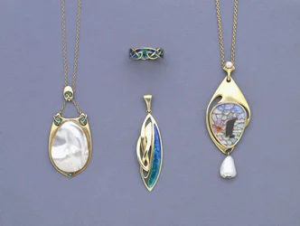 A Group of Liberty & Co Yellow Metal and Enamel Pendants and a Ring Designed by Archibald Knox