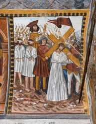 Stories of the Passion of Christ: Jesus goes up to Calvary carrying the cross and helped by Cyrenaeus