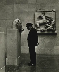 Man looking at sculptures at the British Museum, London 1950s