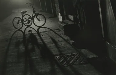 Silhouette of a Tricycle at Night