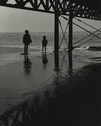 Two kids playing at the beach