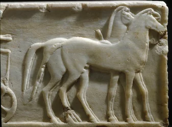 Greek art: “Horses of a quadriga”. Detail of the base of a kouros (statue of a young man). Marble relief. 490 BC. National Archaeological Museum, Athens