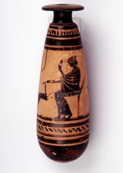 Painting on vase: alabaster used to contain the perfume: one face depicts a woman playing with a doe and holding a flower. Her basket to hold the wool is behind her. 500 BC. BNF, Medal Office