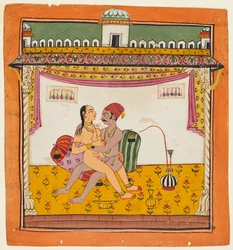 A Couple Seated Against Two Pillows Making Love