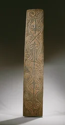 Rectangular New Guinea shield, decorated with carved scrolls in relief, the back with six carved lugs to hold rattan loops, April River