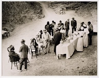 Distinguished visitors taking refreshments near the Tomb of Tutankhamun at the opening of the inner chamber, Valley of the Kings