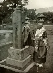 A Buddhist Priest and Praying-Wheel