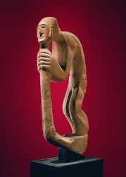 Hunchback holding a staff