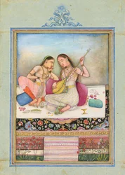 A girl playing the tambur while her companion listens