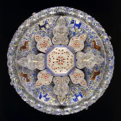 An Indian silver and inset jade sweetmeat dish, depicting lions and elephants amidst dense foliage, early 19th century