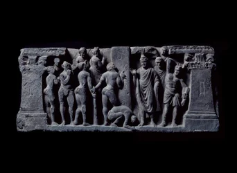Art of Gandhara: Devadatta archers attack Gautama Buddha. Relief of the Gandhara School - 2nd to 4th century - Indian Museum, Calcutta, India