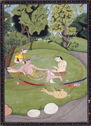 Rama reclining against Sita, while his brother Laksman draws a thorn from his foot