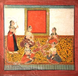 Women playing Parcheesi, seated on a yellow patterned floor spread