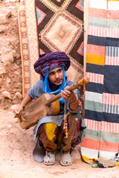 A local musician in the ksar of Ait Benhaddou in Morocco (photo)