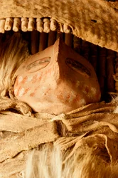At the College of Eastern Utah Prehistoric Museum in Price, Utah, a miniature Fremont cradle board with a ceramic figurine found in the 1930s at the Capitol Reef area