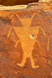 Near Vernal, UT at McKee Springs, Fremont petroglyphs showing warriors holding trophy heads