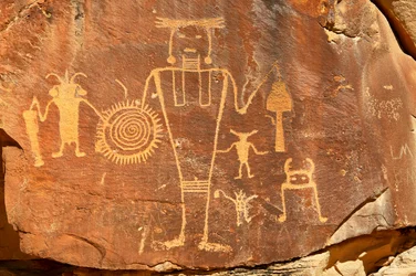 Near Vernal, UT at McKee Springs, Fremont petroglyphs showing warriors holding trophy heads., 2005