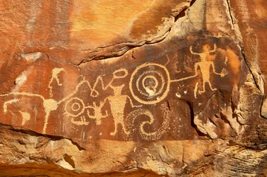 Near Vernal, UT at McKee Springs, Fremont petroglyphs showing warriors holding trophy heads., 2005
