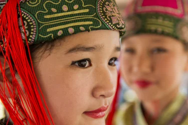 Portrait of a young girl wearing Deel, Mongolian traditional clothing at Naadam