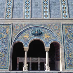 One of the aivans with tiled revetments, grille and monolithic stone columns