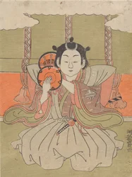 Young man beating a drum