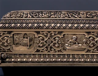 Detail of a miniature human skeleton and sarcophagus