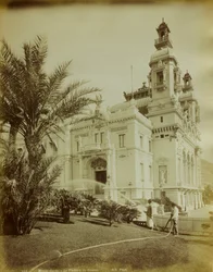 The Theater Annexed to the Casino in Montecarlo. In the Foreground, a View of the Garden Adorned with Palm Trees