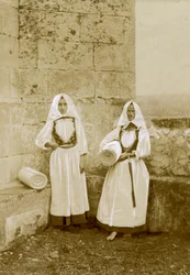Two women wearing traditional costumes, orbace sellers, Sardinia, Italy, circa 1915