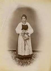 Young Woman Wearing a Wedding Dress and Holding a Ring of Bread Wrapped in Ribbon, Parre, Lombardy, Italy