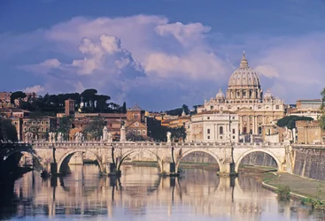 View of Sant Angelo bridge and St Peters across the River Tiber
