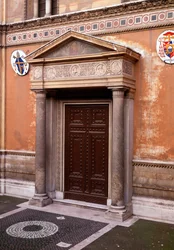 View of the porch with a marble frieze which shows (from left to right) Pastore (the first church owner), Pudenziana, Prassede and their father Pudens, in the middle the mystic lamb