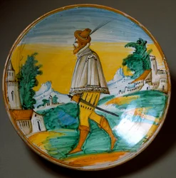 Young gunman. Ceramic plate produced in Viterbo, Italy. End of the 16th century. Florence, Museo Nazionale del Bargello