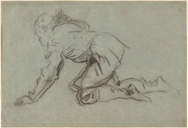 A Kneeling Man Holding a Staff