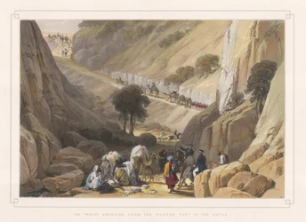 The troops emerging from the narrow part of the defile