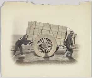 Men hauling a cart
