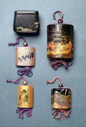 Inro and tobacco pouch: Tobacco Pouch with Hiramaki-e design, signed Zeshin; Inro, foxes wedding procession in Sumi-e Togidashi, signed Toyo; Inro, two sages reading a scroll in Sumi-e