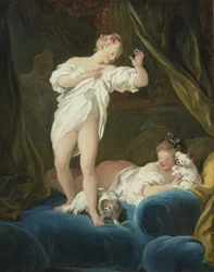 Two Girls on a Bed Playing with their Dogs