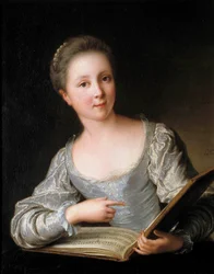 Portrait of a young woman reading sheet music