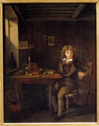 A young student preparing the colors of his master