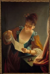 Young woman reading a letter