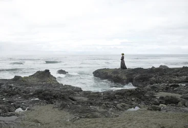 Solitary Woman Coastal View