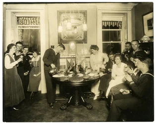 Alice Foote MacDougal entertaining a group of sailors in her small apt in Old War, Greenwich Village, New York, USA, c.1917-18
