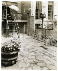 Backyard patio with bird house, New York, USA, c.1905-40