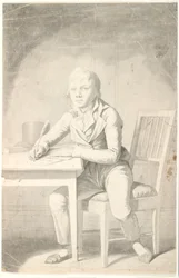 Young Boy Writing at a Table